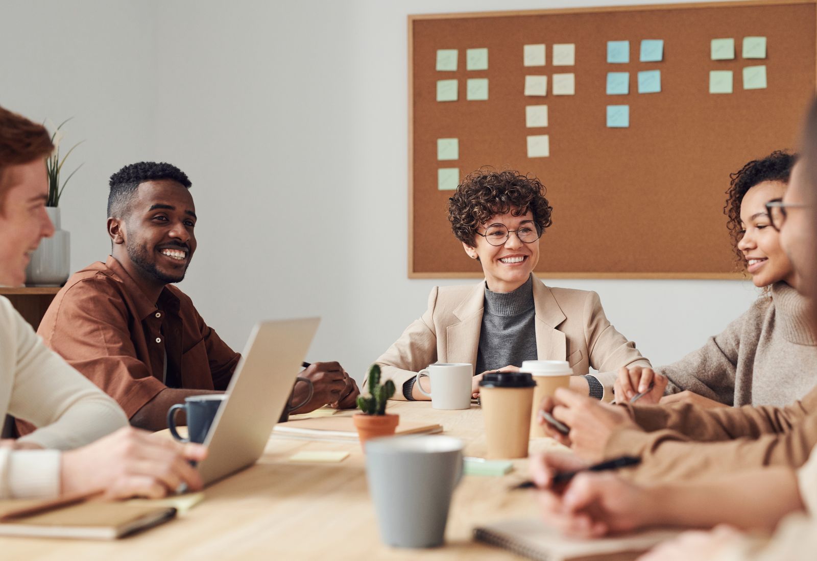 B2B SaaS scale-up launch deck and creative routes on a review desk